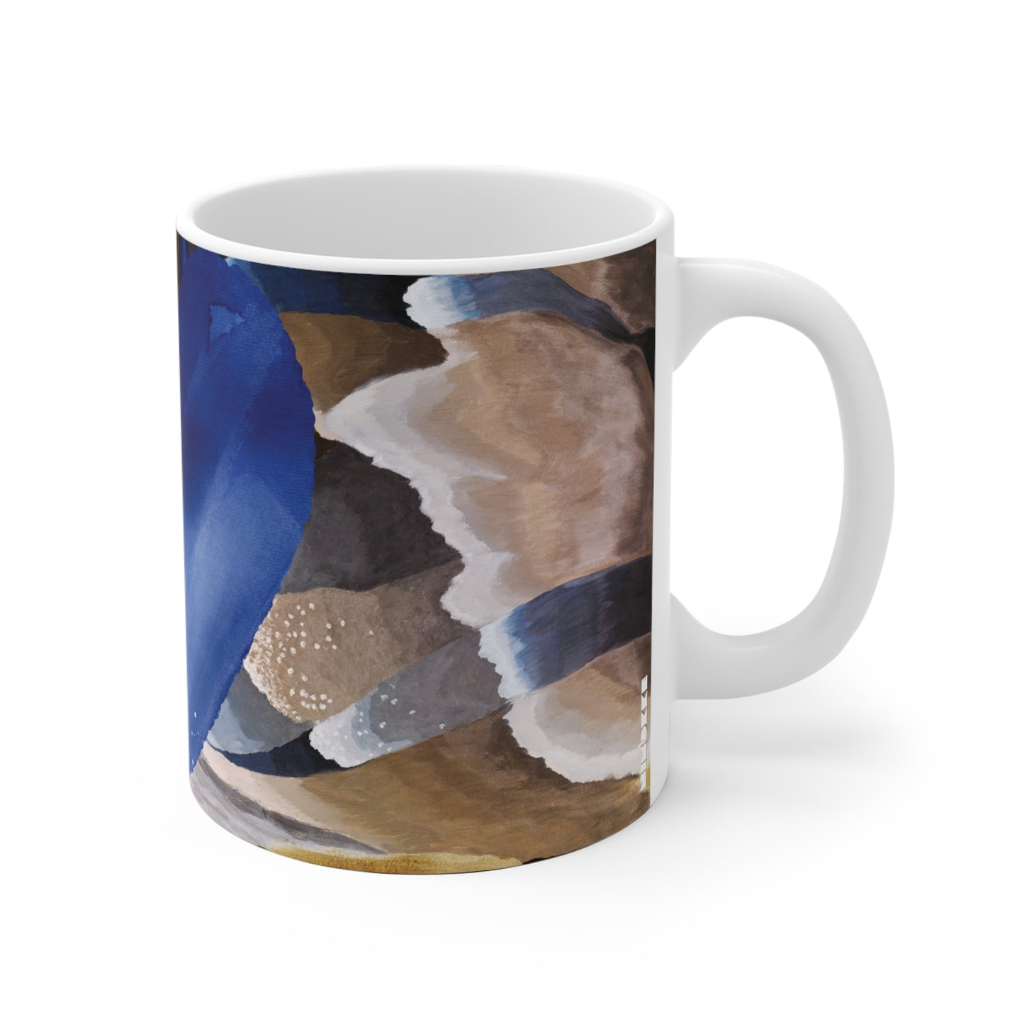 Mug with abstract design of blue, brown, and white with a heart